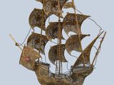 an image of a metal model of a pirate ship on a stand