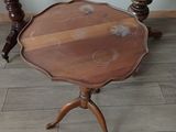 two tables with wooden tops sitting on top of a hard wood floor
