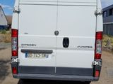 a white van that is parked on the side of the road