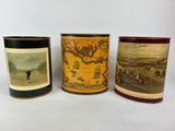 three different types of tins with pictures of people on them