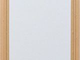 an empty picture frame on a wall with a white background