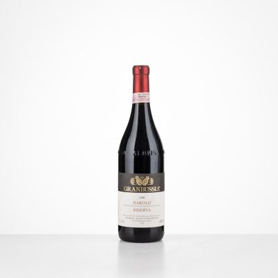 a bottle of red wine sitting on top of a table