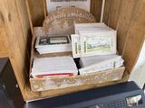 a box full of cards sitting on top of a desk