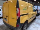 a yellow van that is parked in a garage
