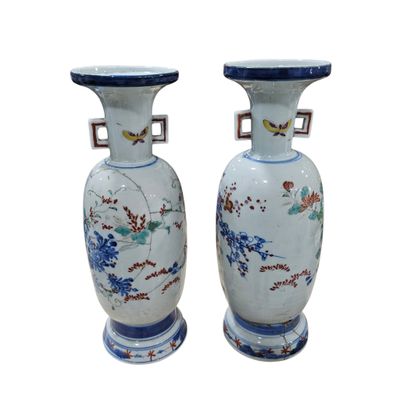 pair of chinese vases with birds and flowers painted on them