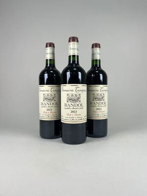 three bottles of wine sitting on top of a table next to each other