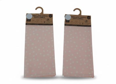 pair of pink and white polka dot socks with wooden hangers