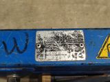 a close up of a blue box with a warning sign on it