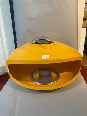 a yellow box with a silver handle sitting on a table