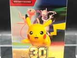 a close up of a box of pokemon trading cards on a table