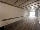 an image of the inside of a truck with wood flooring