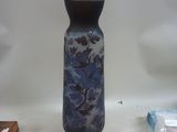 a vase that is sitting on a table next to other items