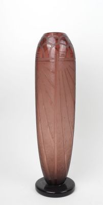a brown vase with a black base on a white background