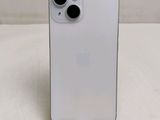 a close up of a white iphone sitting on top of a table