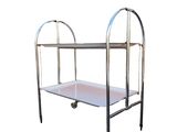 an image of a metal trolley with a white tray on it