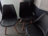 three chairs that are sitting next to each other in a room