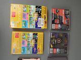 several nintendo games are lined up on a gray surface