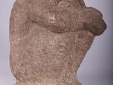 statue of a man holding a baby in his arms