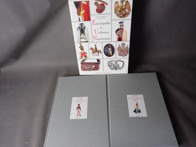 two books that are sitting next to each other on a table