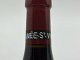a bottle of wine that is sitting on a table