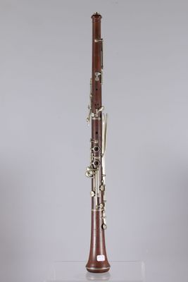 a close up of a clarinet on a clear surface