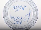 a blue and white plate with blue flowers on it