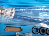 a blue case with tools inside of it on a table