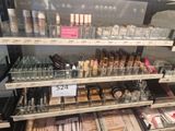 a lot of makeup products on the shelves in the store