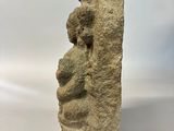 an image of a stone sculpture of a woman holding a baby
