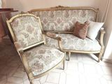 two chairs and a couch in a living room