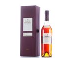 a bottle of whisky with a purple box on a white surface
