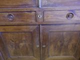 a close up of a wooden cabinet with two drawers