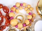 a lot of jewelry that is laying on a table