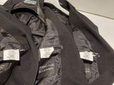 two jackets that are sitting on top of each other