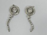 pair of diamond earrings on a white background