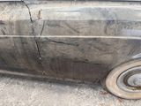 a car that has been damaged and is sitting on the ground