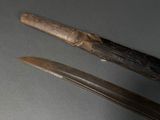 two knives that are sitting next to each other on a table