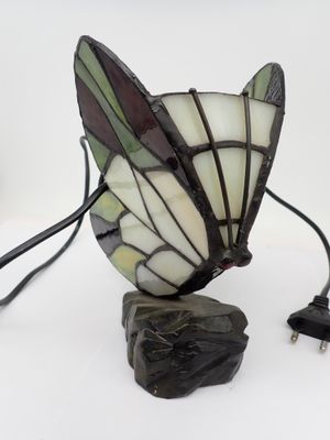 a lamp that is sitting on a table with a cord