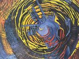 abstract painting of a blue and yellow circular object with a red and yellow center