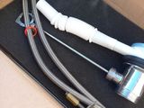 a picture of a box containing a toothbrush, a toothbrush, and a hose