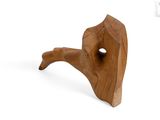 a wooden sculpture with a hole in the middle of it