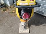 a yellow and black fire hydrant sitting on the ground