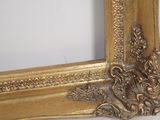a picture of a gold frame with a bird on it