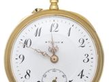 a close up of a gold pocket watch on a white background