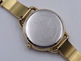 a watch that is sitting on a white surface