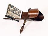 a wooden case with a picture hanging on it