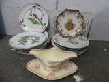 many plates and saucers sitting on the ground