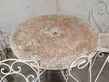 four chairs and a table that are sitting outside