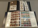 a lot of stamps in a binder on a table