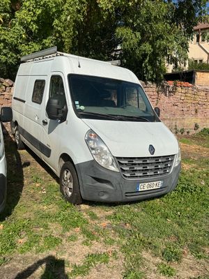 a white van that is parked next to a white van